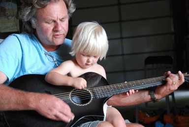 Levi learning guitar